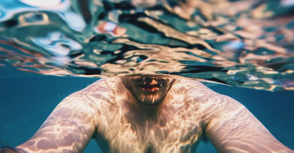 man swimming representing navigating a high sex drive